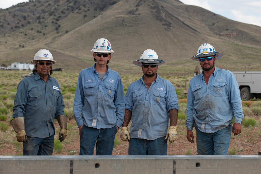 Lineworkers from PWC and the Navajo Tribal Utility Authority (Stone Johnson pictured right).