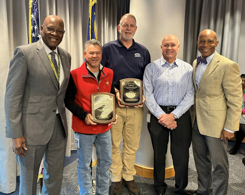 From left: Public Works Commission Chairman Donald Porter, PWC worker Del Coffman, PWC worker Jason Green, PWC Chief Water Officer Mick Noland and CEO Timothy Bryant.