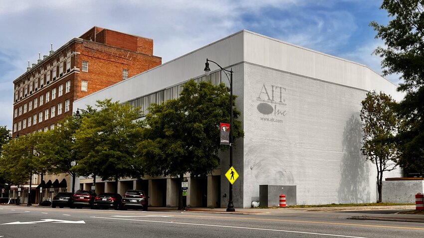 The former AIT Building next door to The Residences at the Prince Charles in downtown Fayetteville on Tuesday, April 16, 2024. The owners nearly sold the building in March, about a year after they bought it.