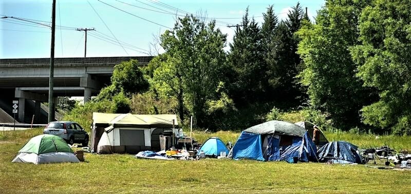 An encampment of homeless people at Gillespie Street and the Martin Luther King Jr. Freeway in May 2023. Tawana Dawkins, who works for Cumberland County's Community Development department, said more people in the county are in transitional housing and temporary shelter after the city of Fayetteville began clearing such encampments last year.