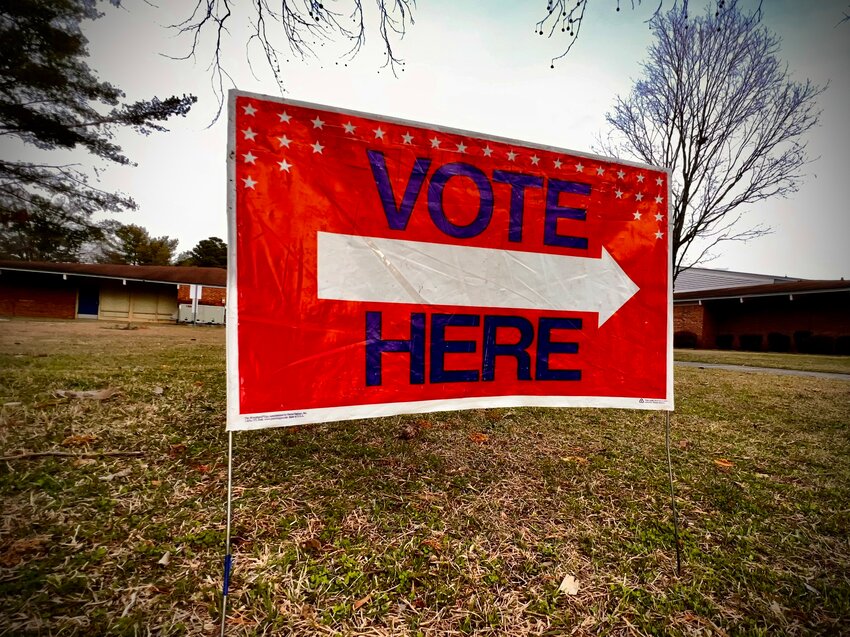A 'vote here' sign guided voters to the polls at the Cross Creek 15 voting precinct at Glendale Acres Elementary School in Fayetteville during the March primary.