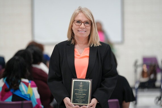 Cumberland County Schools Social Worker of the Year Shannon Sykes is presented with her award at a March 14, 2024, ceremony.