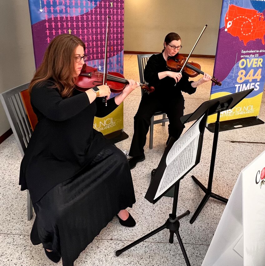 Megan Kenny and Holland Phillips of the Camellia Chamber Music Project perform at the Skyview on Hay Event Center on Tuesday, April 16, 2024, during a Morning of Insights presentation by the Arts Council of Fayetteville/Cumberland County.