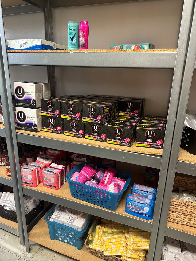 Period products on the shelves of the Warriors Pantry at Alger B. Wilkins High School on April 19, 2024. The pantry is one of the ways the school system tries to prevent period poverty from forcing students to miss class.