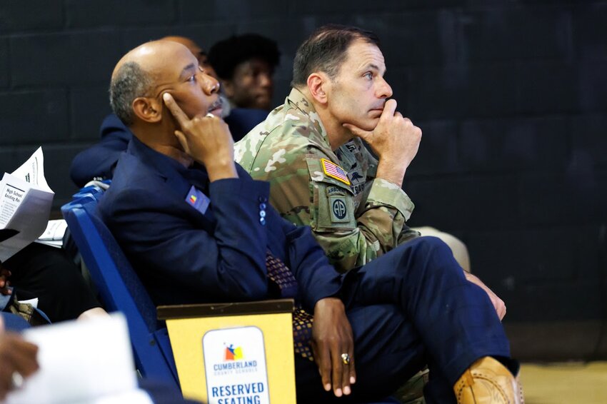 Cumberland County Schools Superintendent Dr. Marvin Connelly Jr. (left) and Lt. Gen. Christopher Donahue (right), commanding general of Fort Liberty and the XVIII Airborne Corps, listen during a town hall on E.E. Smith High School's future on Tuesday, April 23, 2024. Some alumni were enthused by the information presented at the town hall, while others remain skeptical.