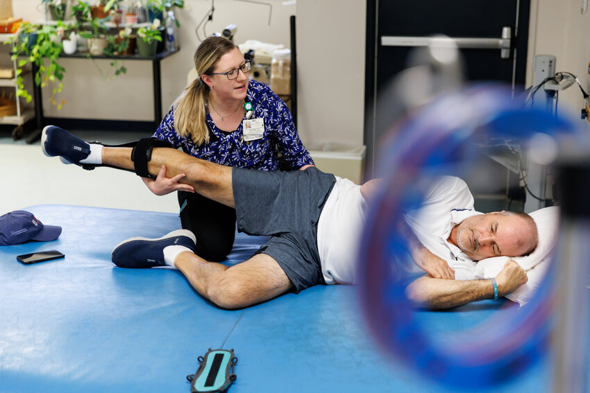 Physical therapist Rachel Farnham treats Kenneth Merritts as he recovers from the effects of having a stroke.