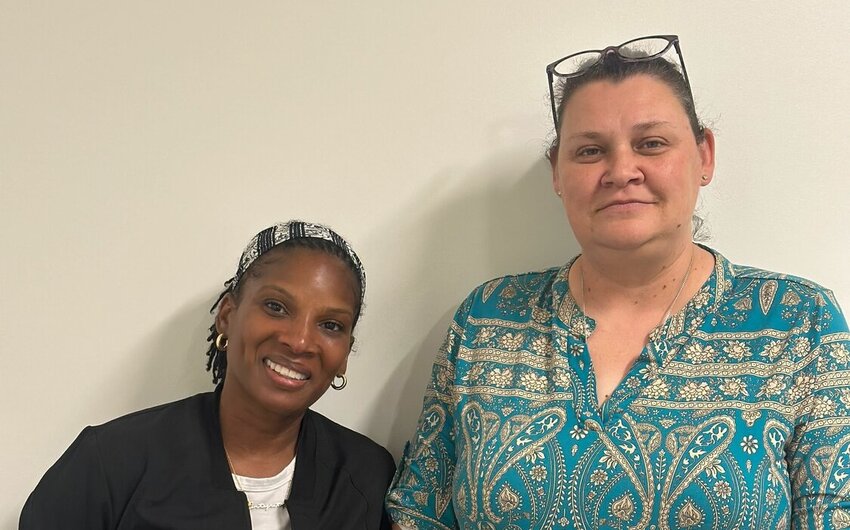 Lydia Nichols, left, and Ilana Sheppard, right, pose at the Day Resource Center on May 1. Nichols and Sheppard work together to educate Cumberland County residents on mental health and connect those in need with resources.