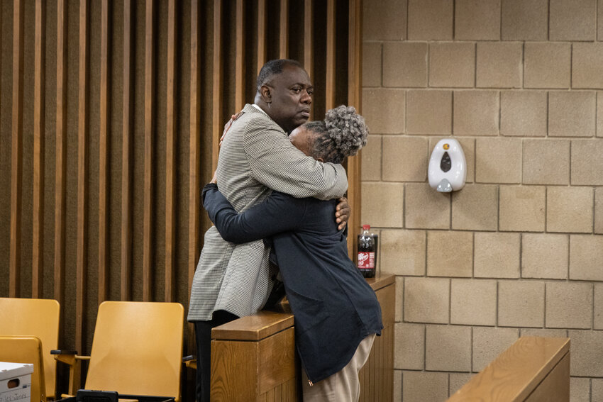 Former Terry Sanford High School girls' basketball coach Thurston Jackie Robinson hugs his wife, Charlotte, in Cumberland County Superior Court on Thursday, May 16, 2024. This was a few minutes after a Cumberland County jury returned a verdict that it had not seen sufficient evidence to conclude Robinson sexually assaulted one of his former players, Miya Giles-Jones. Giles-Jones had sued him for $2.5 million.
