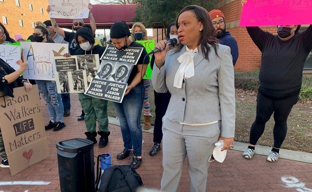 About 100 people marched through downtown Fayetteville on Sunday demanding justice and an arrest after Jason Walker was shot and killed by an off-duty Cumberland County sheriff’s deputy over the weekend.