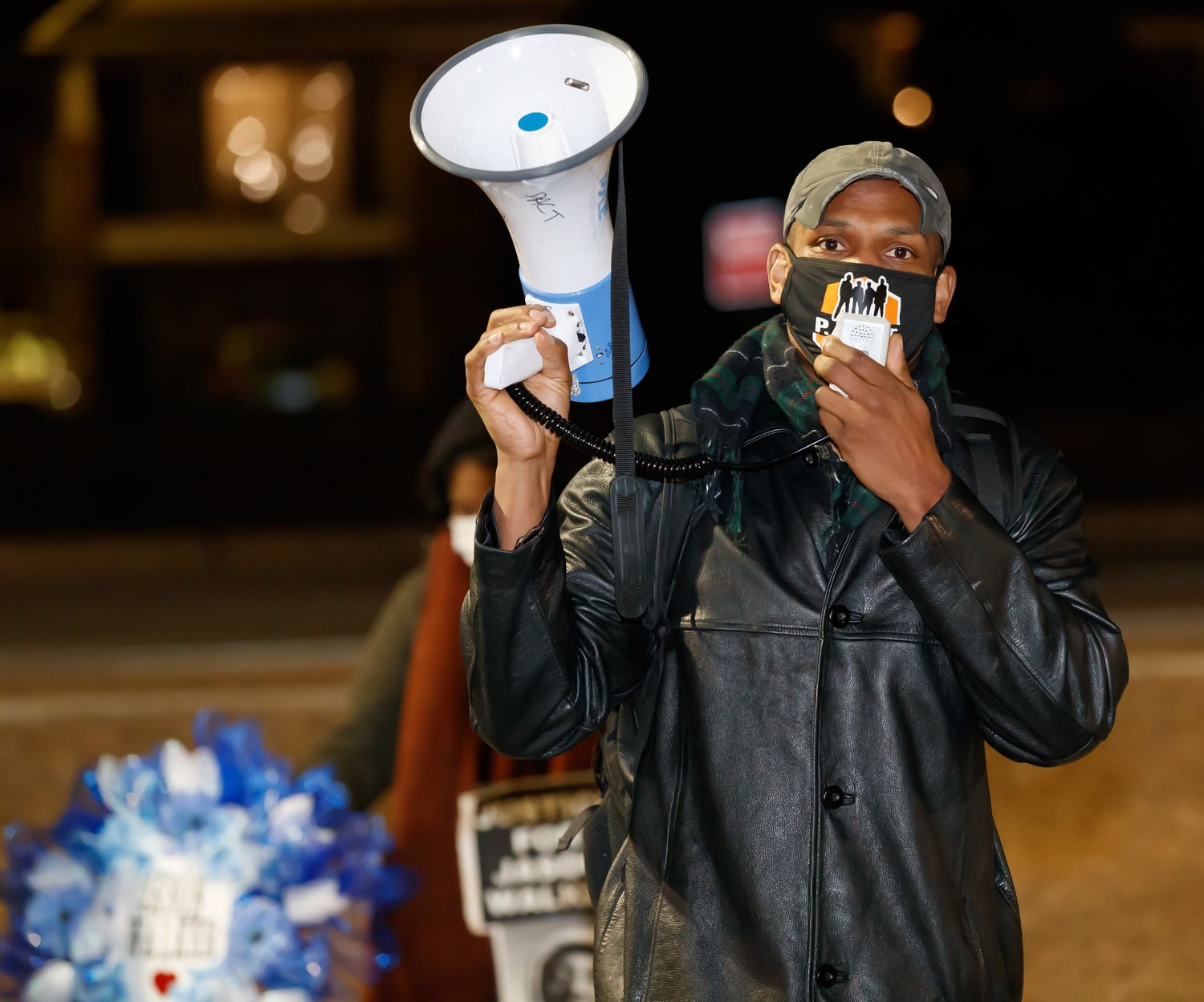 Shaun McMillan, one of the leaders of the Fayetteville Police Accountability Community Taskforce, addresses a crowd that gathered Wednesday night on Bingham Drive to protest the shooting of Jason Walker.