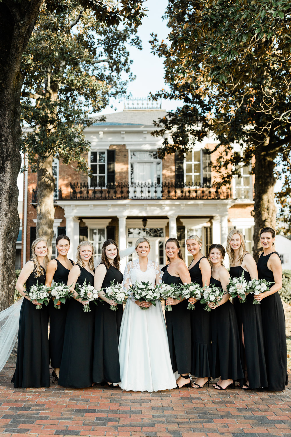 The Axtells Wedding Photography & Films captured the many special moments of the Dec. 31, 2021, wedding of Mary Kate Morgan and Joseph Riddle IV. Here, Mary Kate is pictured with bridesmaids, left to right, Jessie Keener, Patricia Kalevas, Marian “Covey” Holmes, Elizabeth Moorman, maid-of-honor Sebrell Singleton, Jillian Kaehler, Catherine Moorman, Jane March Riddle and Anna Huff.