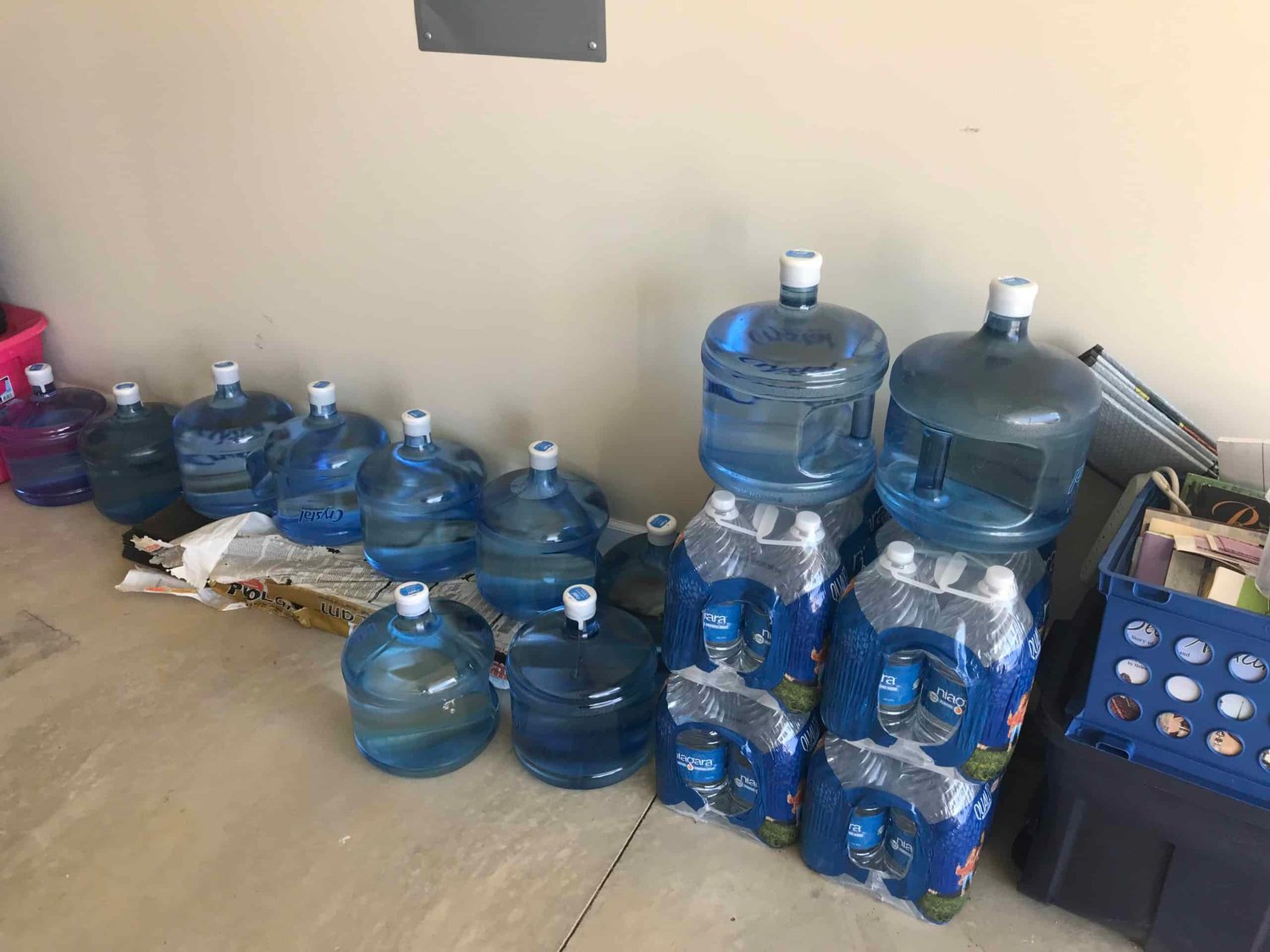 Water jugs are stacked up in Carter Bryant's garage. Carter, who lives in the James’ Place neighborhood near N.C. 87 and Alderman Road, found out shortly after buying his home in 2019 that the well water was contaminated with PFAS.