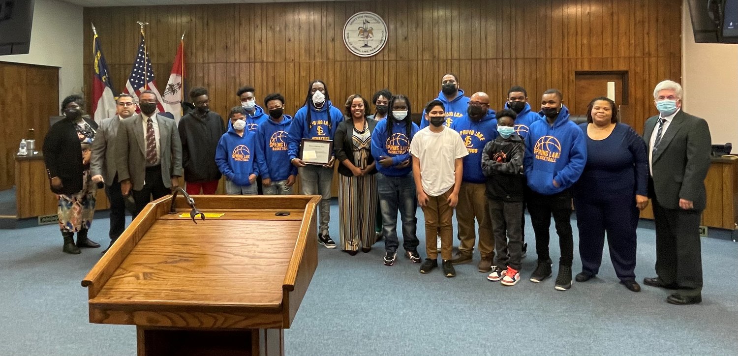 The boys' basketball team at Spring Lake Middle School was recognized Monday night by the Spring Lake Board of Aldermen for winning their Division III Championship.