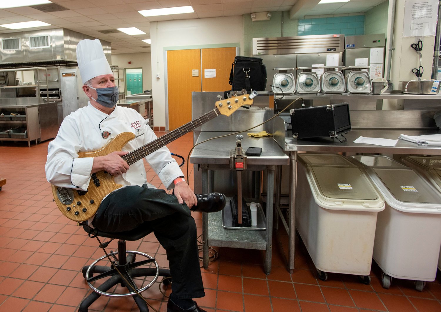 Alan Dover's bass guitar comes in handy in his culinary arts classroom at Fayetteville Technical Community College.
