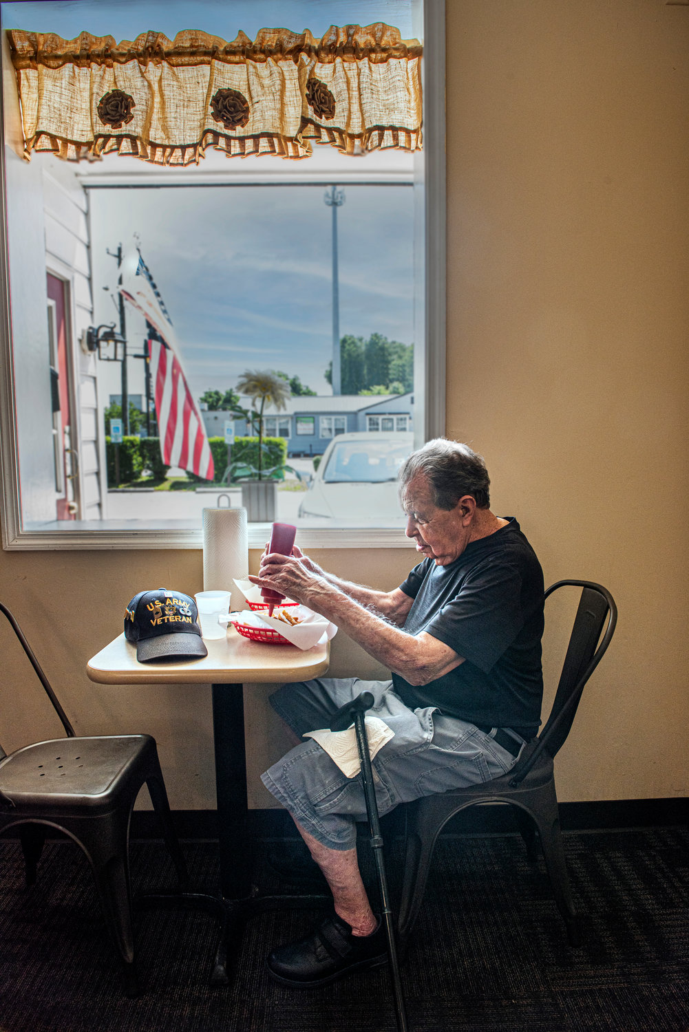Army veteran Jimmie Ward is a regular who always orders the same thing: Two hot dogs “all the way,” a strawberry milkshake with a spoon and a cup of water.