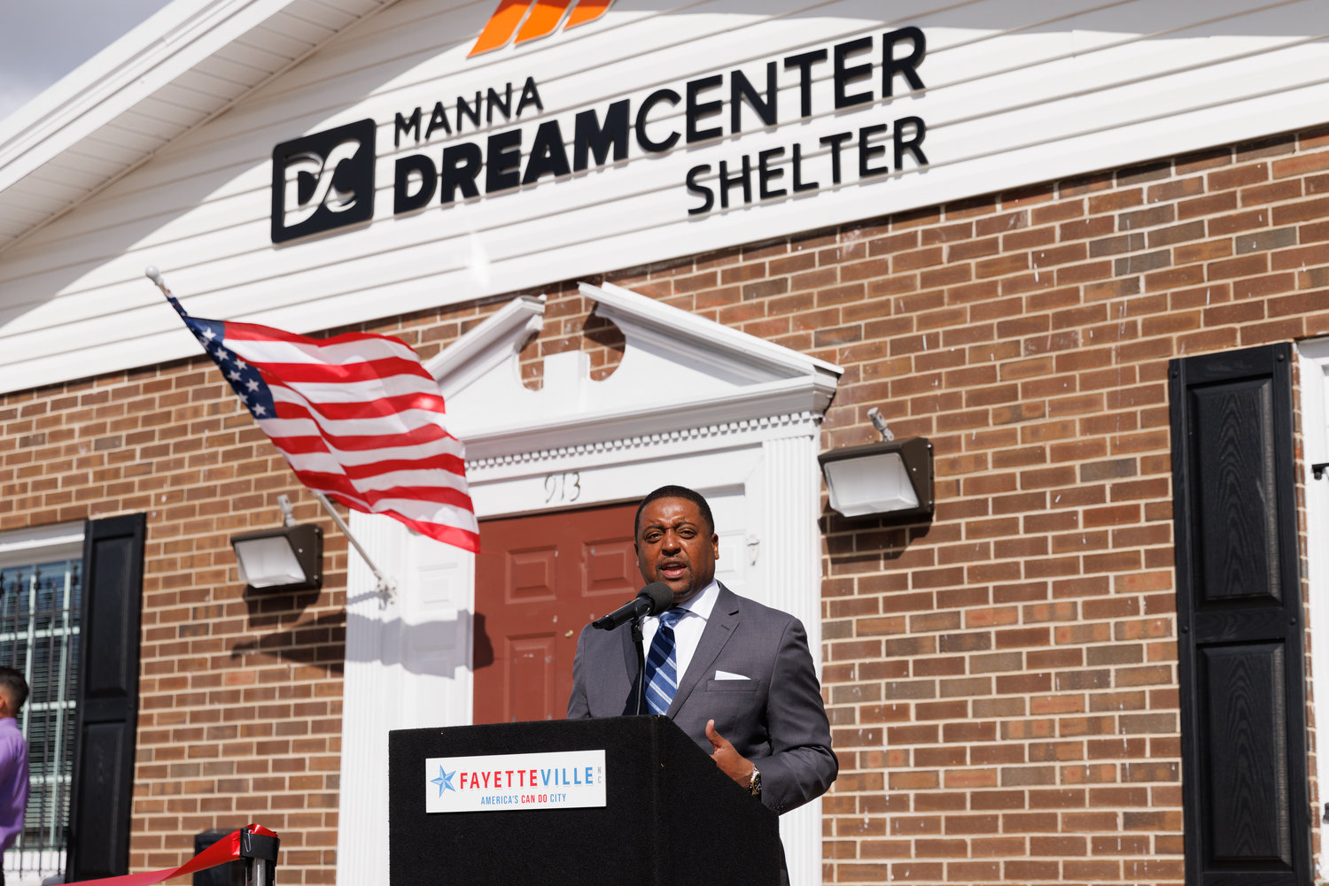 Fayetteville Mayor Mitch Colvin talks during the ribbon-cutting for the Manna Dream Center Shelter at 913 Person St. on Friday.