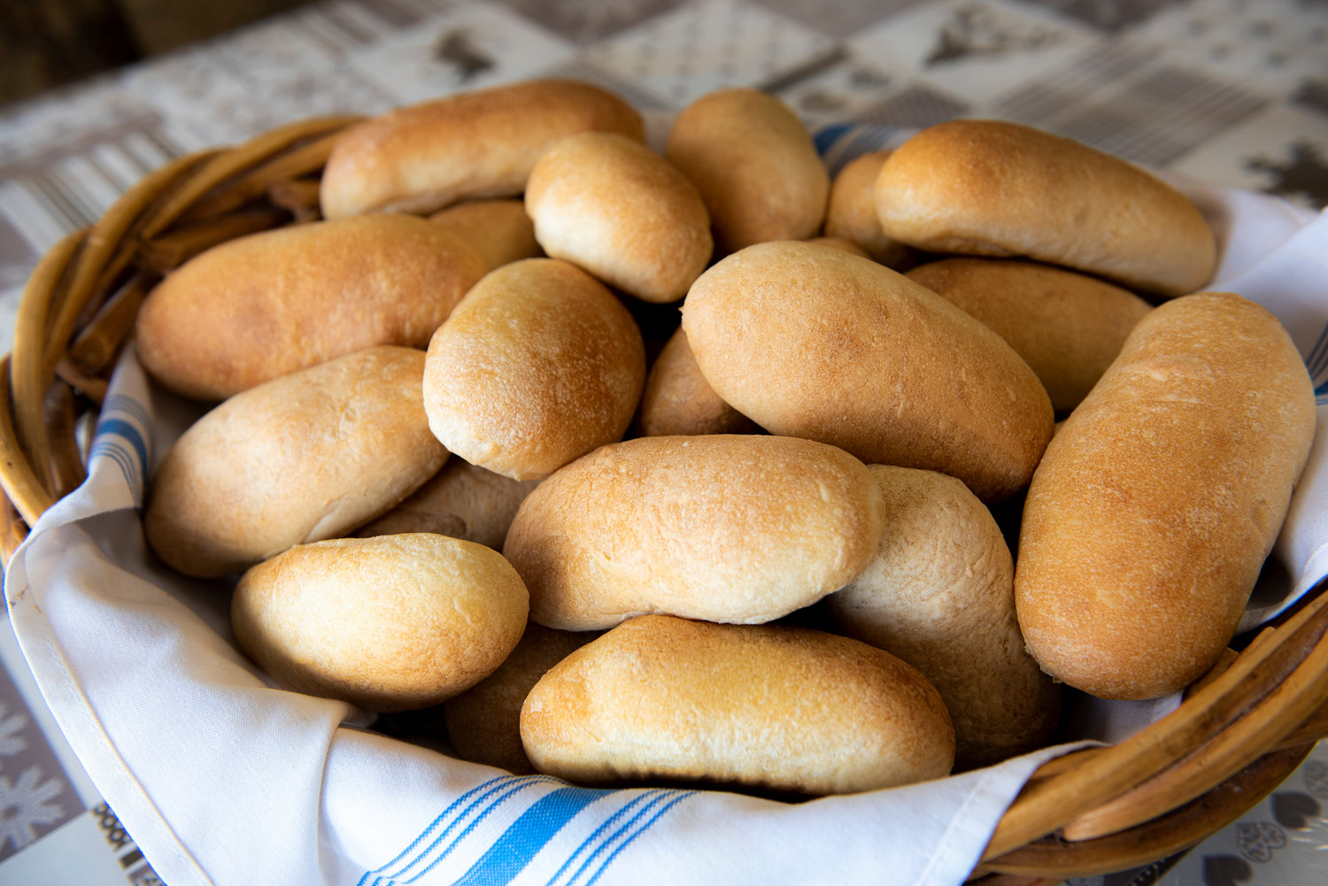 A basket of fresh-baked brötchen rolls.