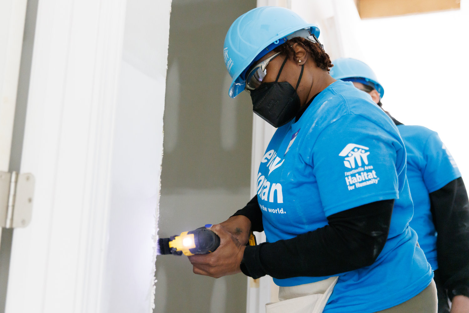 Monique Smith cuts off excess wood from a door frame during the Fayetteville Area Habitat for Humanity's annual "Women Build'' event on March 5. The organization announced Tuesday that it has received a $5 million gift that it will use to address affordable housing issues in Cumberland, Sampson and Bladen counties.
