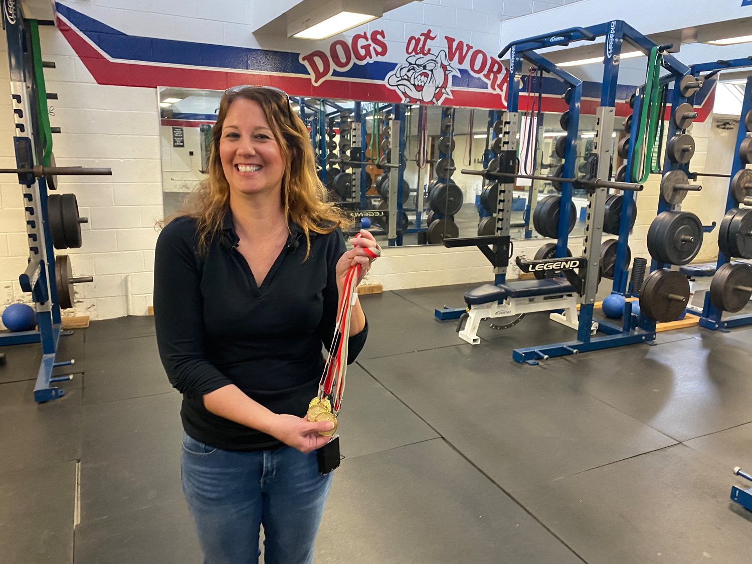 Nancy Chilton holds the gold medals that her son Jett won at the 2019 N.C. Special Olympics Summer Games. Those weightlifting wins qualified him for the 2022 Special Olympics USA Games in June.