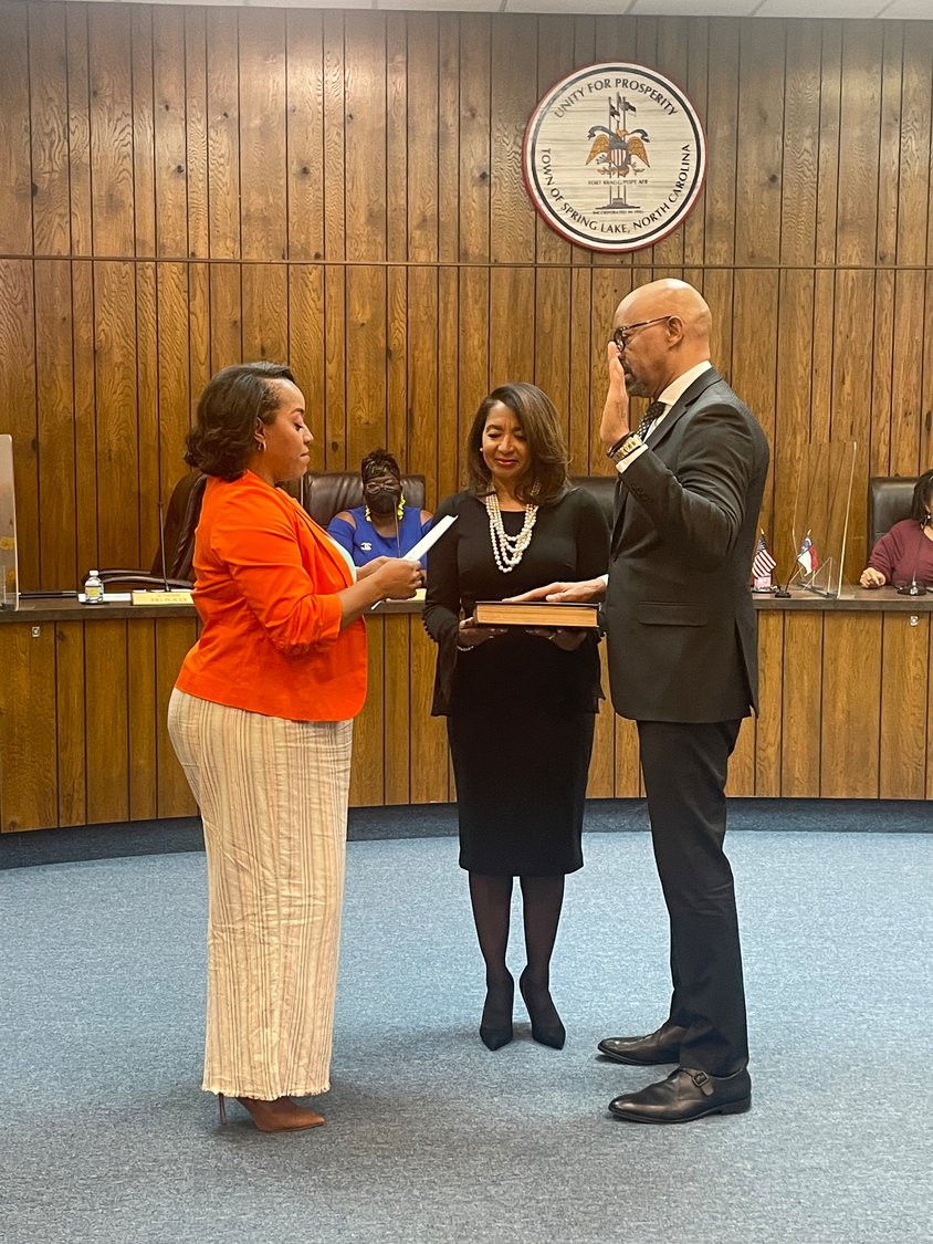 Spring Lake Mayor Kia Anthony, left, swears in Joe Durham as the interim town manager on March 28. Durham's contract was approved by the Local Government Commission on April 18.