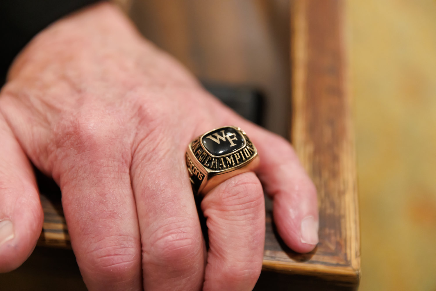 Jack McGinley wears a ring commemorating Wake Forest's 1955 NCAA College World Series championship.