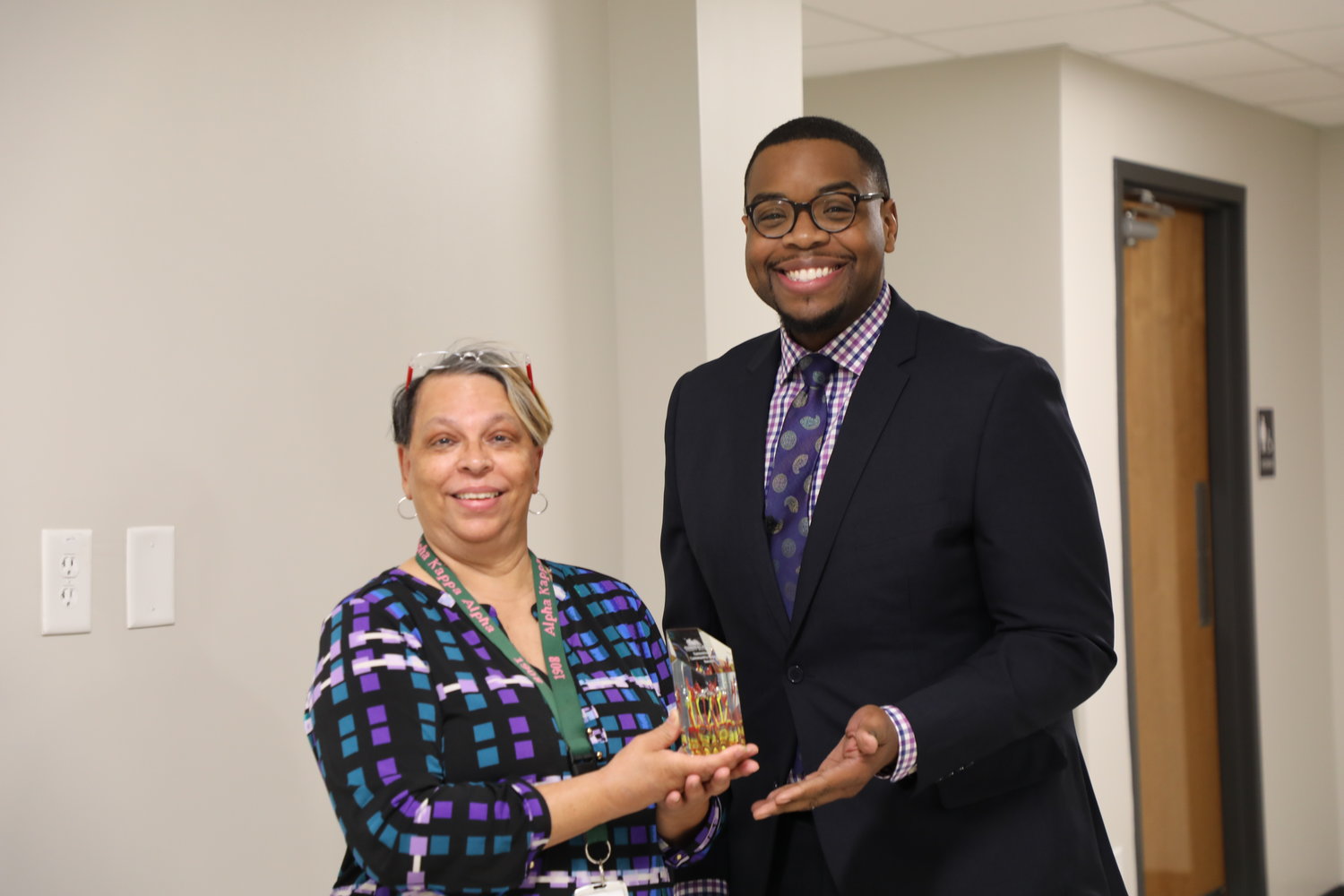 Sharon Glover, the System of Care coordinator for Alliance Health, received the April 2022 Committed Community Support Award. She is pictured with Lindsay Whitley, the associate superintendent of Communications and Community Engagement.
