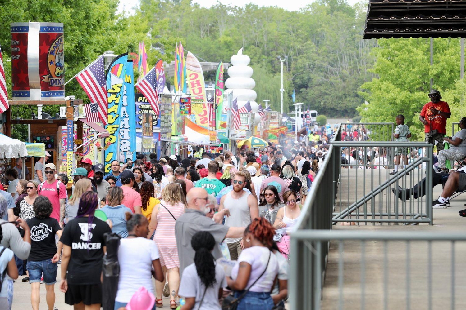 Food vendors line the promenade leading to Festival Park during the 40th Fayetteville Dogwood Festival on April 23. The mayor and members of the City Council talked with the festival's executive director about having more diversity in the festival's entertainment.