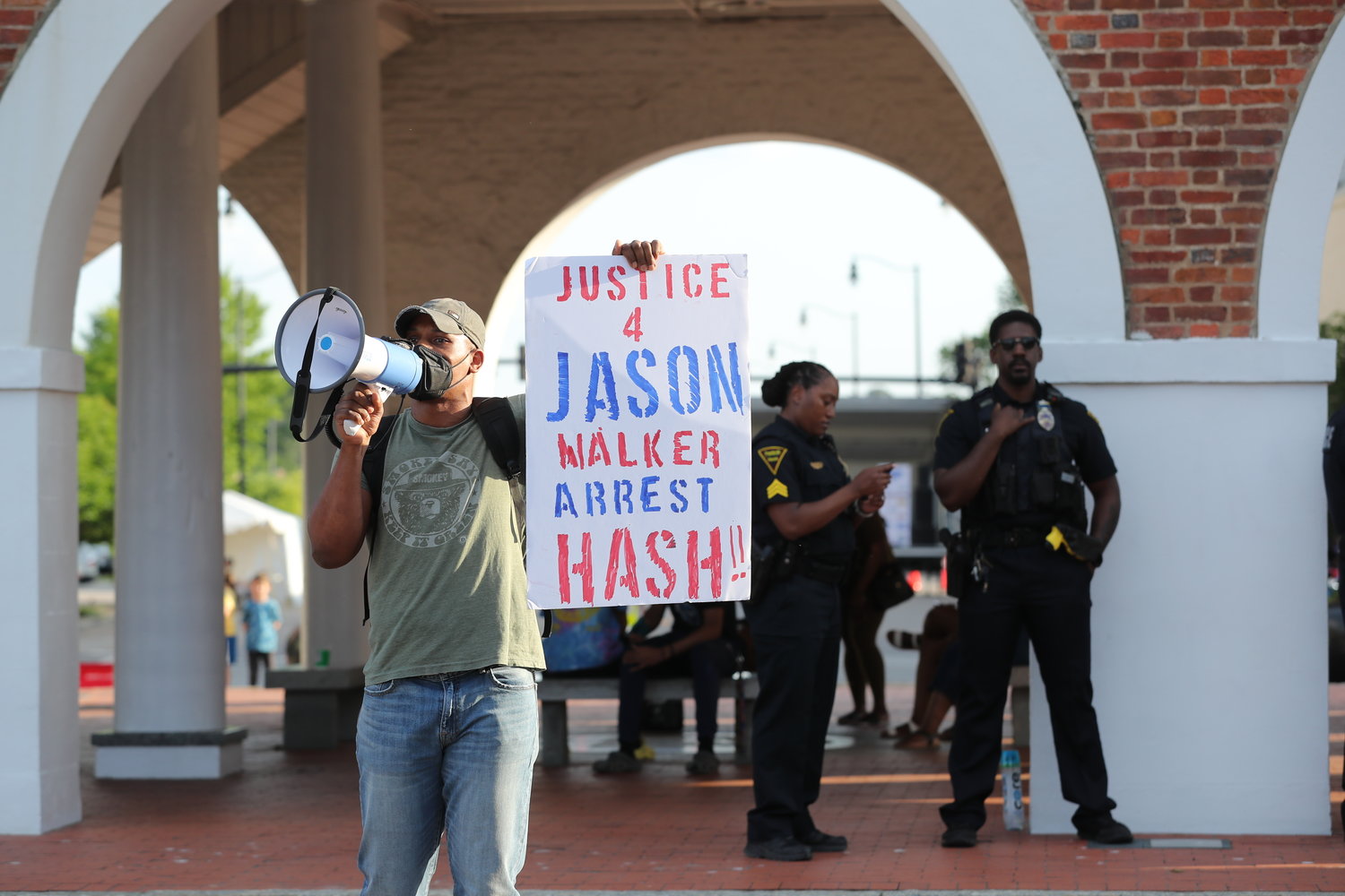 Activist Shaun McMillan organized a protest at the Market House on Saturday to demonstrate against a decision by a special prosecutor not to charge a deputy in the shooting death of Jason Walker.