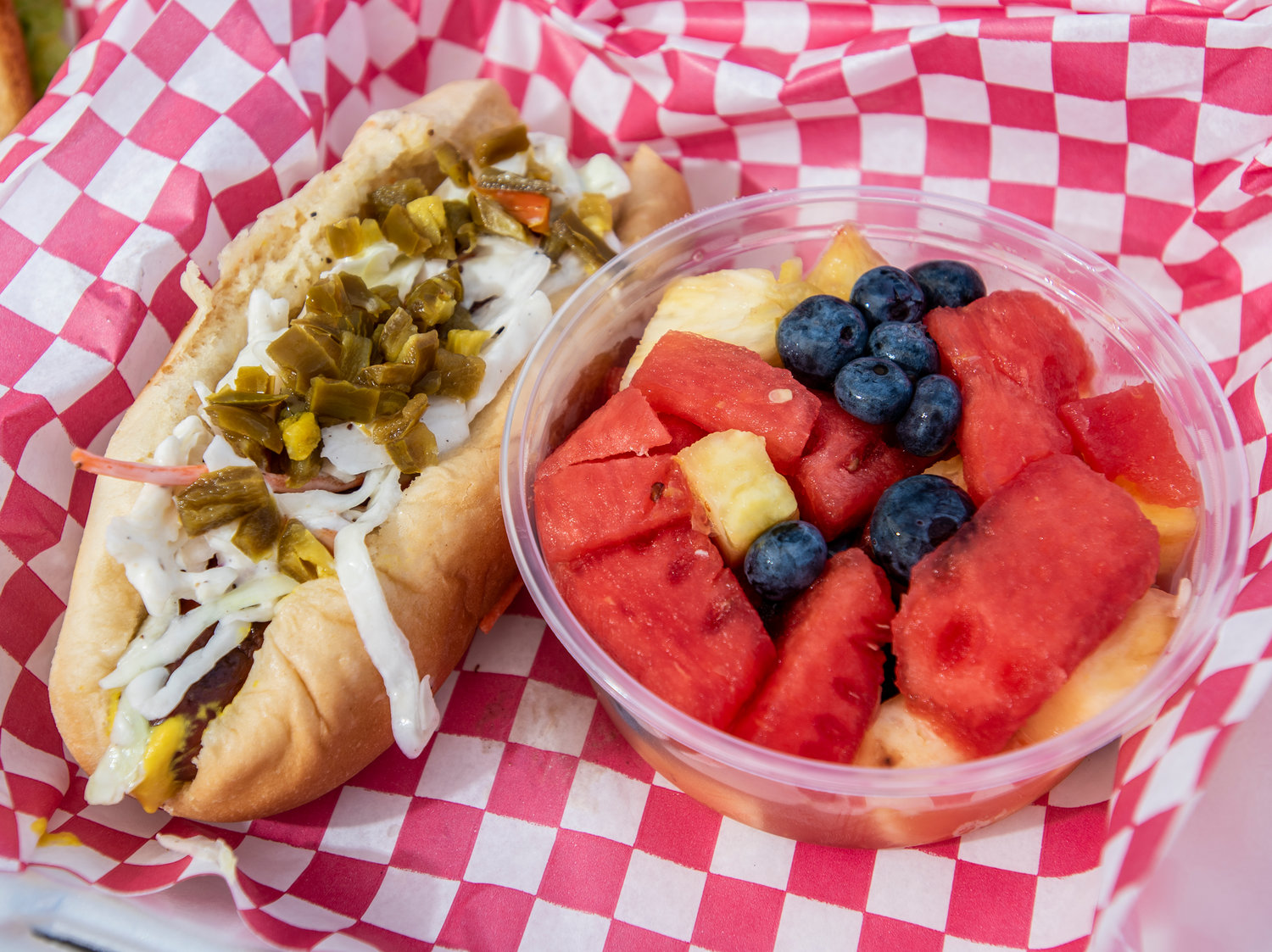Grilled Hot Dogs with jalapeno pepper home made coleslaw and Fresh cut Fruit.
