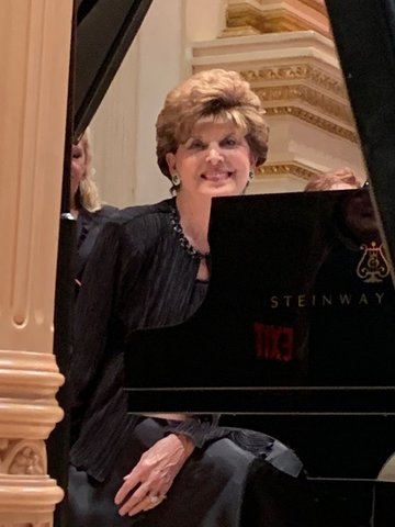 Joy Cogswell in 2019, when she accompanied North Carolina conductor and composer Pepper Choplin at Carnegie Hall and his 225-member choir.
