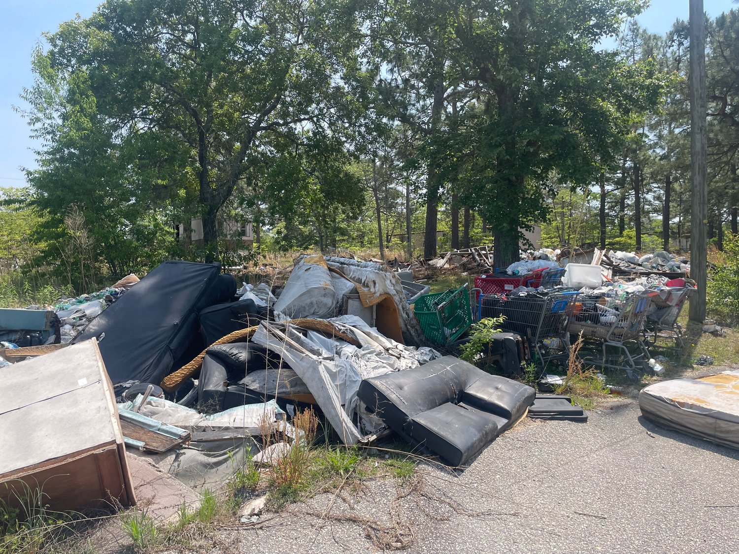 Trash and grocery carts are commonplace in some of the older mobile home parks in  Spring Lake. Time Out Communities is buying mobile home parks in Spring Lake and elsewhere with the intention of cleaning them up and bringing in energy-efficient units to replace older models.