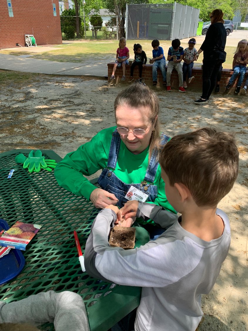 Members of the Cross Creek Briarwood Garden Club and Cumberland County master gardeners helped students at Alma Easom Elementary School plant seeds as part of a program in observance of Earth Day.