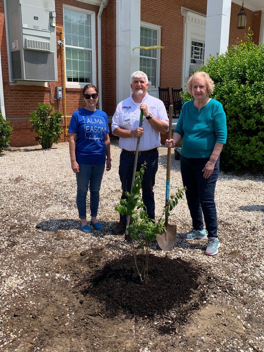 Rebecca McAlister, principal at Alma Easom, Allen West, with the N.C. Extension Service, and Sybil West, president of the Cross Creek Briarwood Garden Club, after a crepe myrtle was planted at the school on April 29.