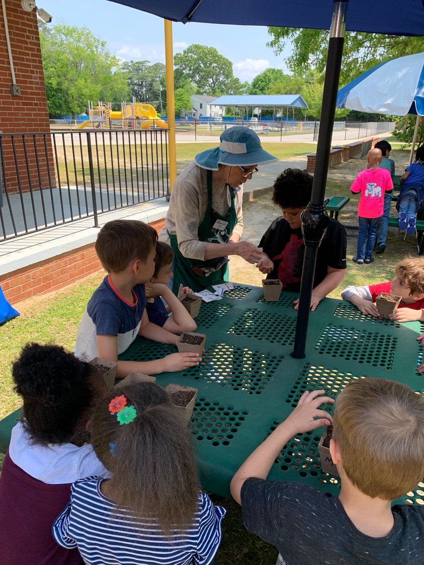Members of the Cross Creek Briarwood Garden Club and Cumberland County master gardeners helped students at Alma Easom Elementary School plant seeds as part of a program in observance of Earth Day.