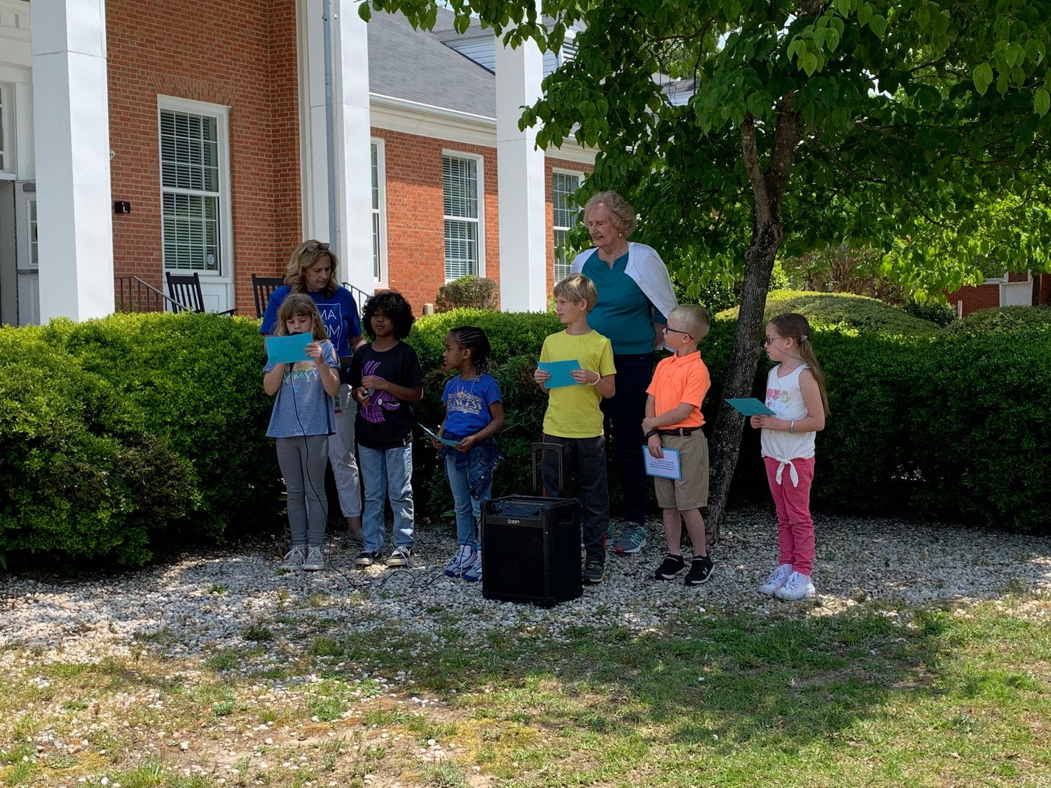 First-graders at Alma Easom Elementary School presented a program April 29 during a tree planting event in observance of Earth Day.