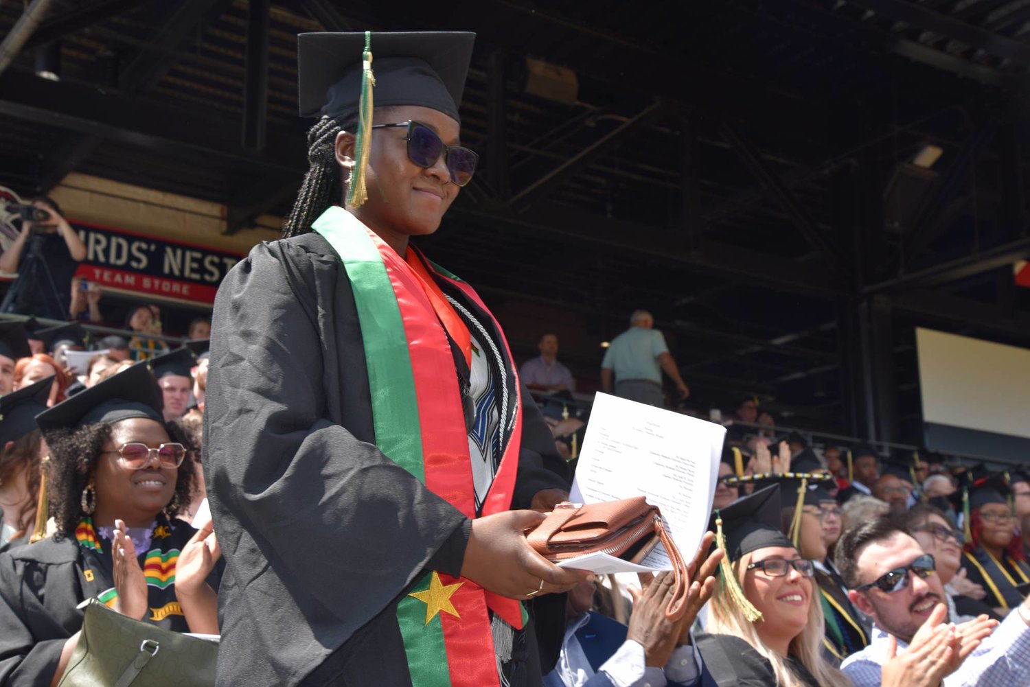 International student Nerketa Damiba is recognized during Methodist University's spring commencement Saturday. She and two other international students were recognized for becoming the first Methodist University graduates from their respective countries.