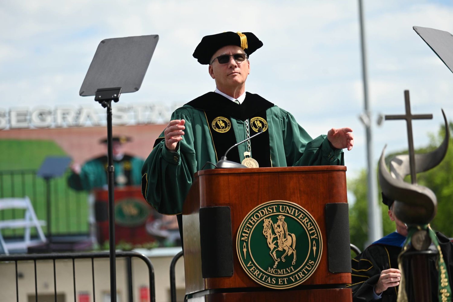 Methodist University President Stanley T. Wearden addresses the Class of 2022 during the 59th annual spring commencement ceremony at Segra Stadium on Saturday.