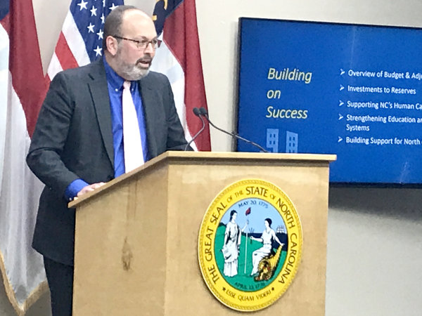 State budget director Charles Perusse on Wednesday laid out Gov. Roy Cooper’s spending plan for the coming fiscal year. State coffers are more full than originally expected.