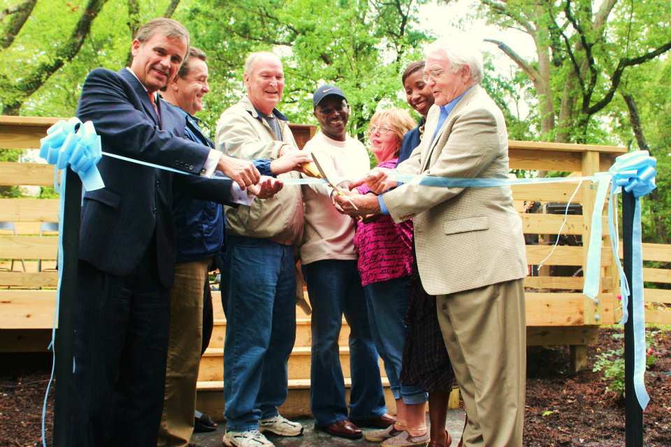 Harry Shaw with city officials and others during a dedication for a bridge at Cross Creek Linear Park in April 2012.