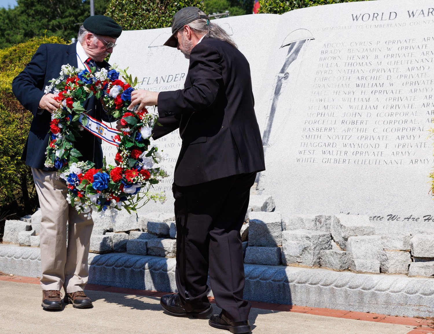 Wreaths were placed at monuments honoring the fallen from various wars.