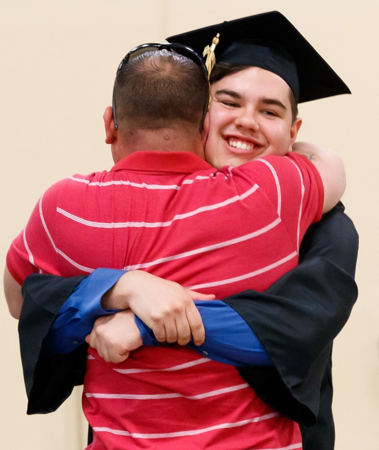 Alex Anderson hugs his father, Sfc. William Dubnansky, at his graduation on Wednesday.