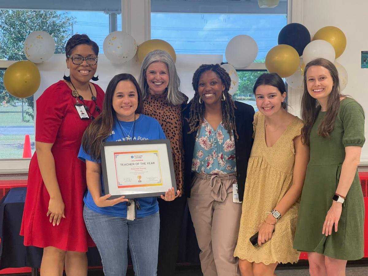 Anayansi Young with W.H. Owen Elementary School administrators and staff from Participate Learning. Young, a fourth-grade Spanish Immersion teacher at W.H. Owen, has been named one of three 2022 Participate Learning Teachers of the Year.