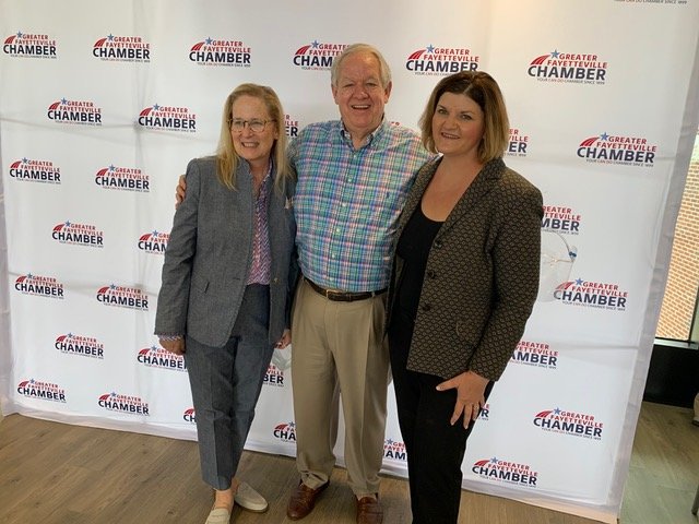 Shari Fiveash, left, with George Breece and Elaina Ball in May 2021 when Fiveash was announced as the new president and chief executive officer of the organization. Fiveash resigned from the position last month.