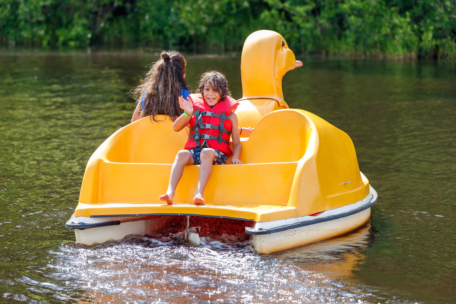 Tiffany and Micolas Costillo ride the duck paddle boat at the Smith Lake Recreation Area.