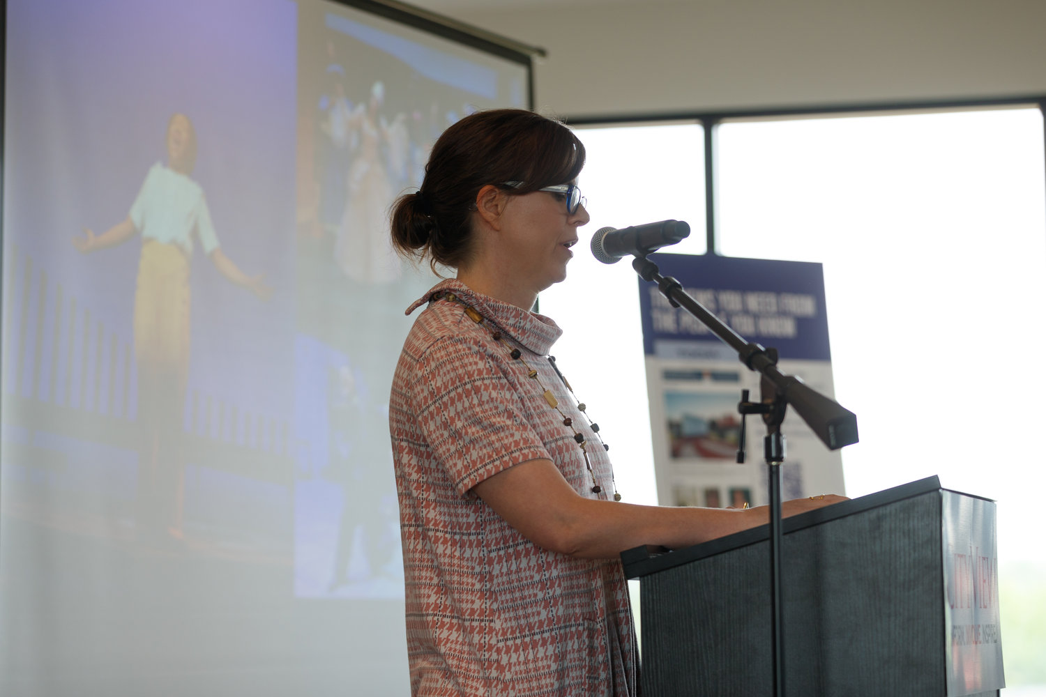 Mary Kate Burke, artistic director at Cape Fear Regional Theatre, talks about the theater's recent renovation and future expansion project during the 2022 CityView Downtown Visionaries Luncheon Wednesday at Segra Stadium.