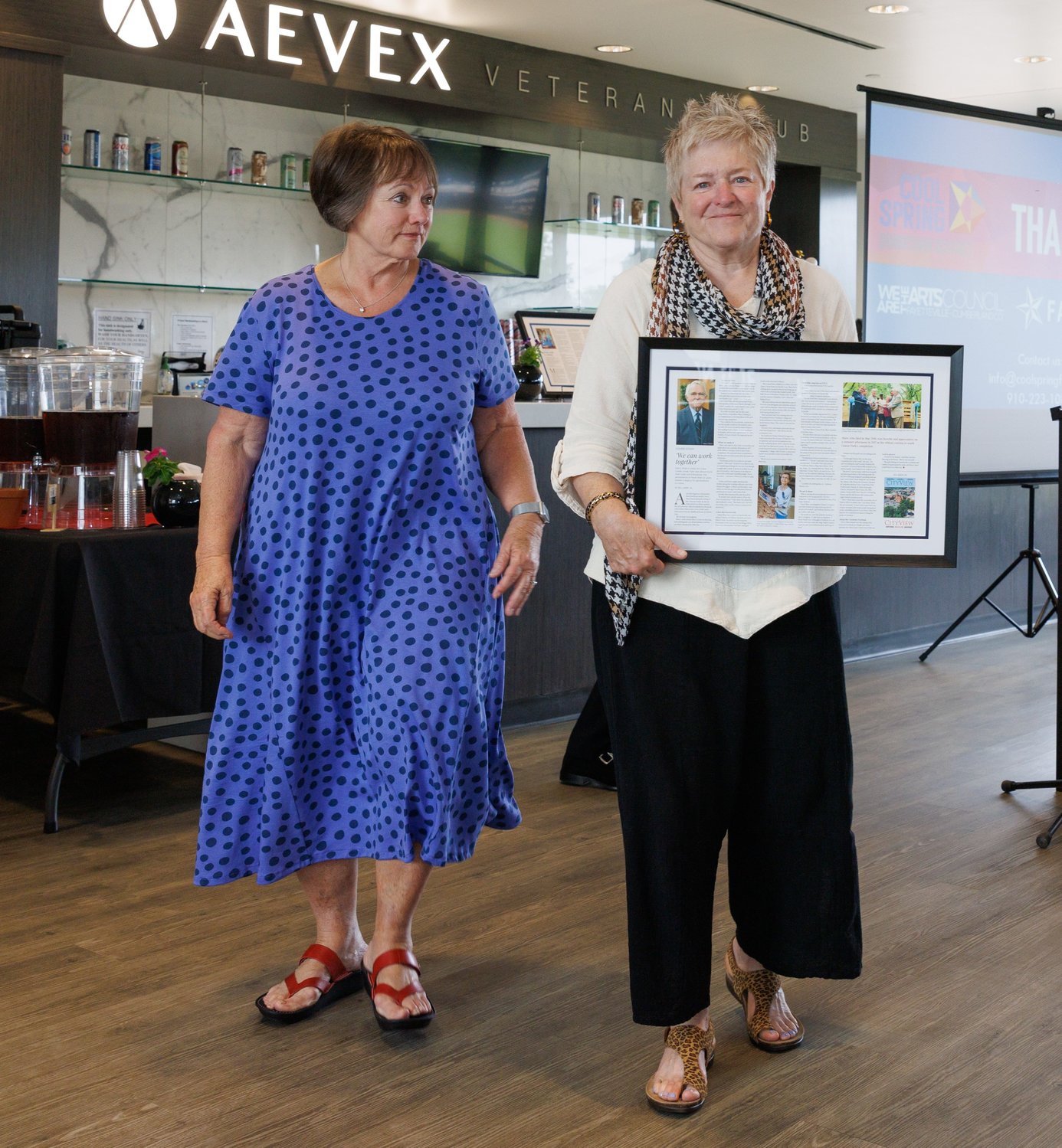 Sally Schmitz and Faison Covington accept the CityView Downtown Visionaries Award that recognized their father, the late Harry Shaw. Shaw was a driving force behind Cross Creek Linear Park in downtown Fayetteville. The awards luncheon was Wednesday at Segra Stadium.