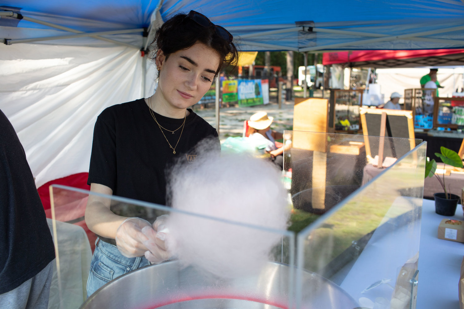 Kaya Gordon prepares some cotton candy at her business' stand named Munchies.