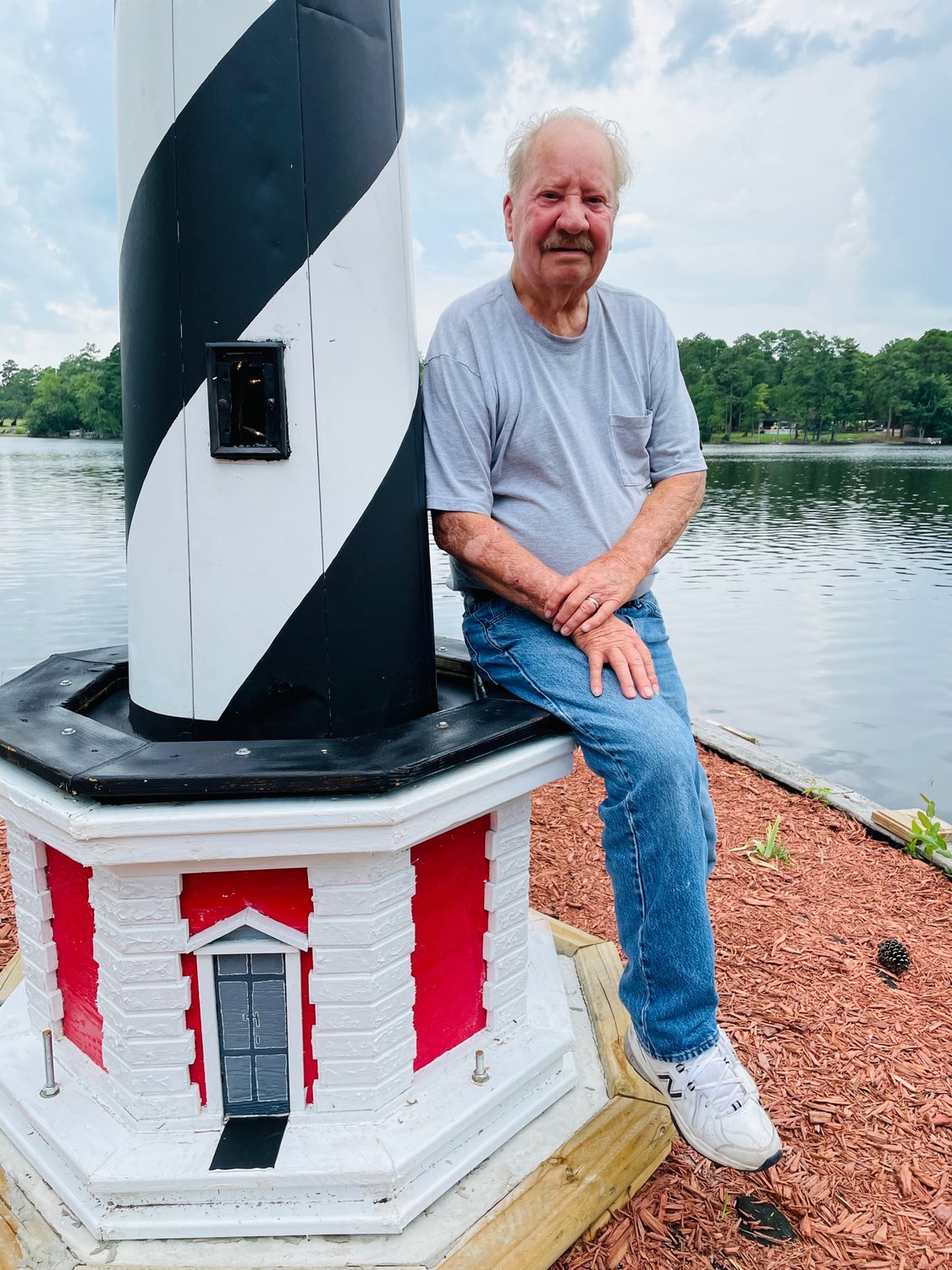 ' I knew it was special to him,' Elbert "Rex'' Lucas said of the damaged lighthouse behind his friend's house. 'Something had to be done with it rather than it going to waste.' Lucas, with the help of family and neighbors, worked to restore the lighthouse in memory of his friend Billie Hooks.