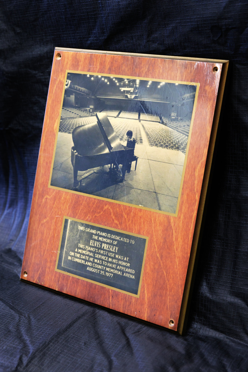 Milton Smith is pictured on a plaque playing a grand piano that was dedicated in memory of Elvis Presley at the Cumberland County Memorial Arena. Smith played at a memorial service at the arena on Aug. 25, 1977, the day Elvis was supposed to appear in concert there.