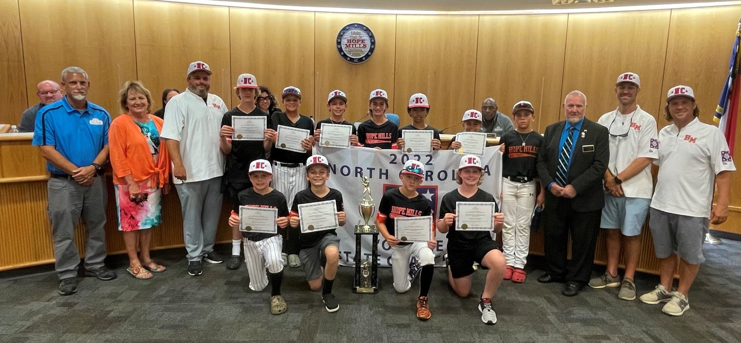 The Hope Mills Board of Commissioners on Monday night recognized the Hope Mills 2022 “O” Zone D1 State Champion Baseball Team led by head coach Tommy Daughtry. The team now advances to the 2022 D1 Dixie Youth World Series on Aug. 6 in Lumberton.